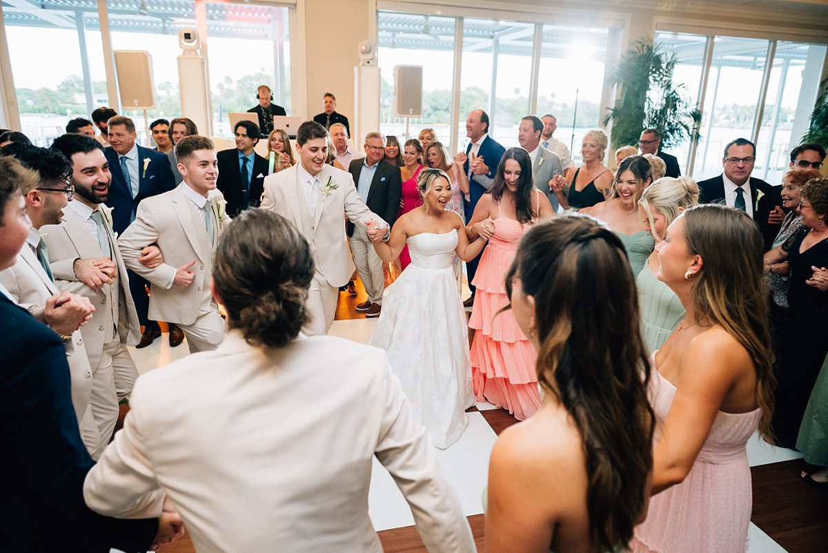 joyful wedding reception waterfront Pelican Club