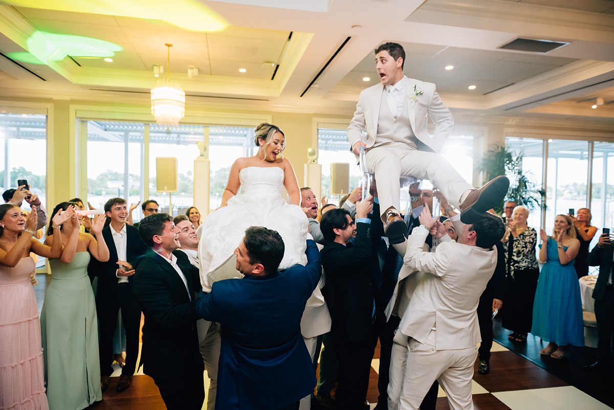 joyful wedding reception waterfront Pelican Club